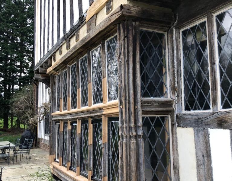 Tudor property with hatched windows